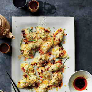 Pork and Chive Dumplings with Red Chile Oil Recipe | MyRecipes.com